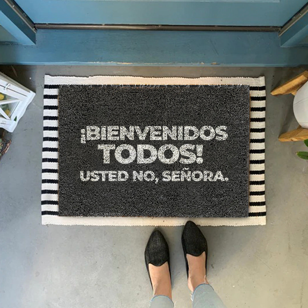 Felpudo ¡Bienvenidos todos! Usted no, señora.